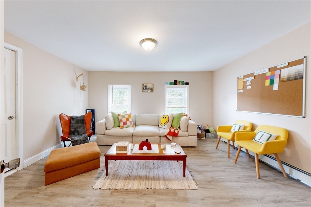 249 North Main Street Webster, MA 01570 - Photo 25 of 32 a living room with furniture and wooden floor