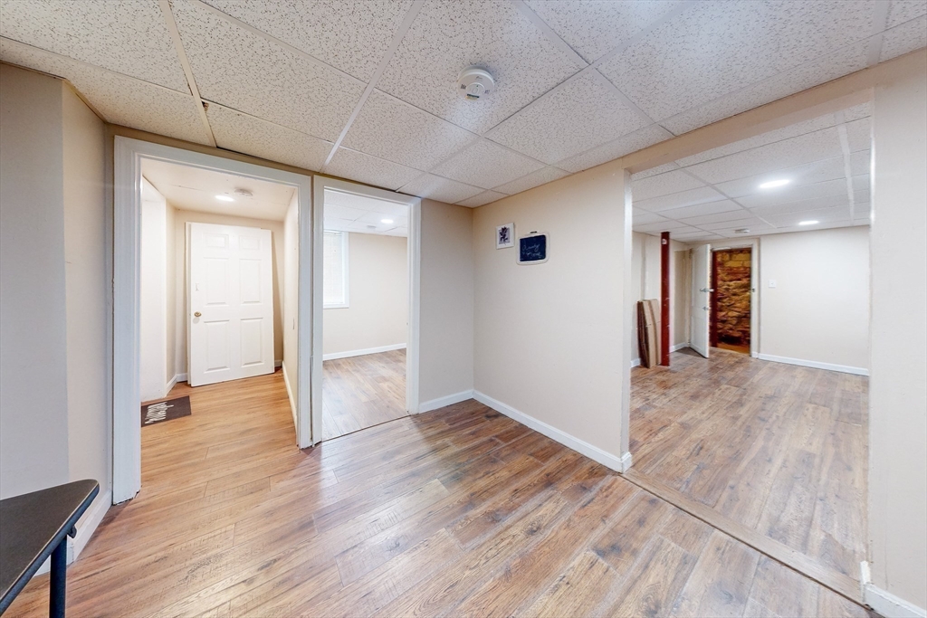 249 North Main Street Webster, MA 01570 - Photo 27 of 32 wooden floor in an empty room with a window