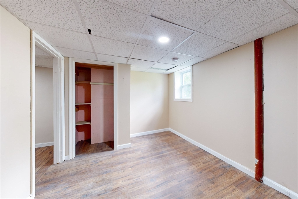 249 North Main Street Webster, MA 01570 - Photo 30 of 32 an empty room with closet and wooden floor