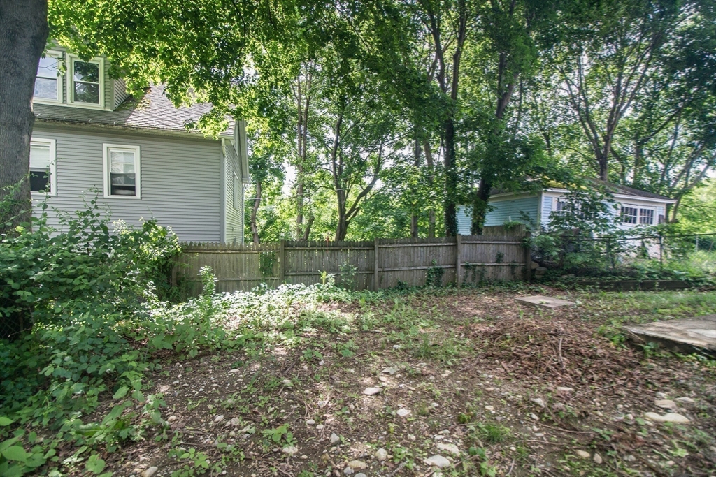 249 North Main Street Webster, MA 01570 - Photo 32 of 32 a backyard of a house with lots of green space