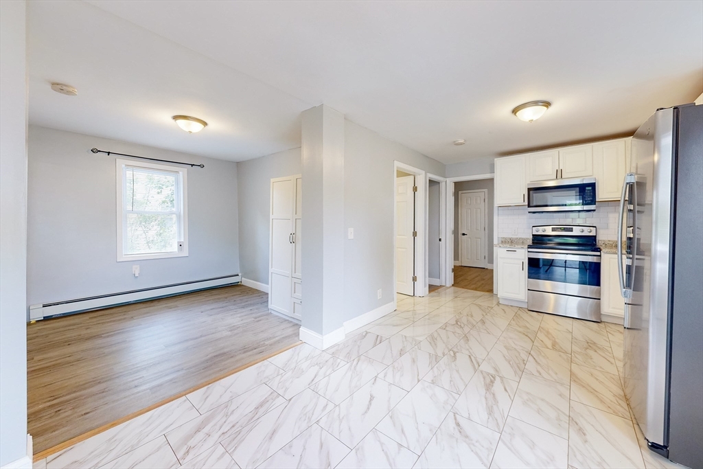 249 North Main Street Webster, MA 01570 - Photo 5 of 32 a view of empty room with a kitchen