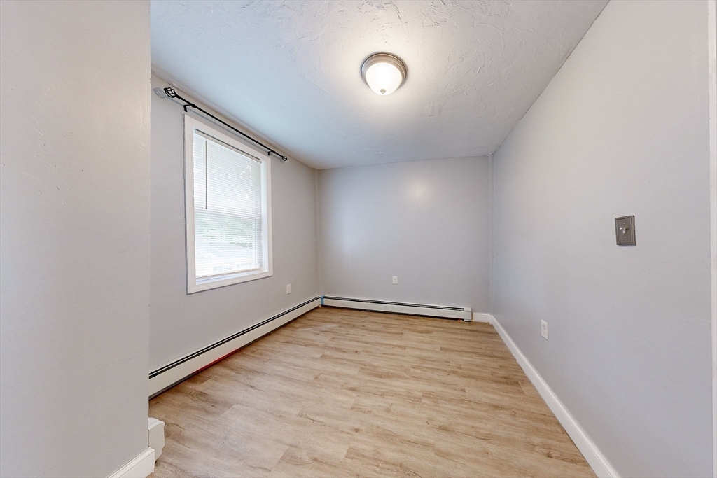 249 North Main Street Webster, MA 01570 - Photo 10 of 32 an empty room with a window