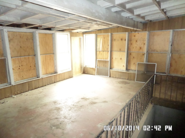 11480 Bell Road Lemont, IL 60439 - Photo 5 of 14 a view of an empty room with wooden floor and windows