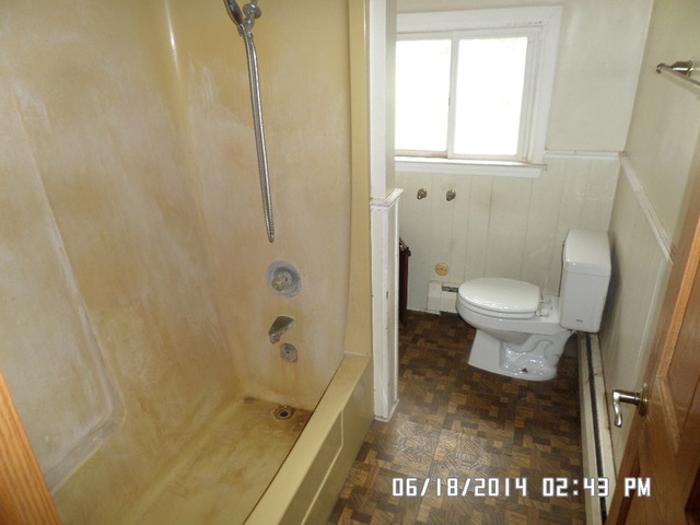 11480 Bell Road Lemont, IL 60439 - Photo 8 of 14 a bathroom with a toilet and a shower