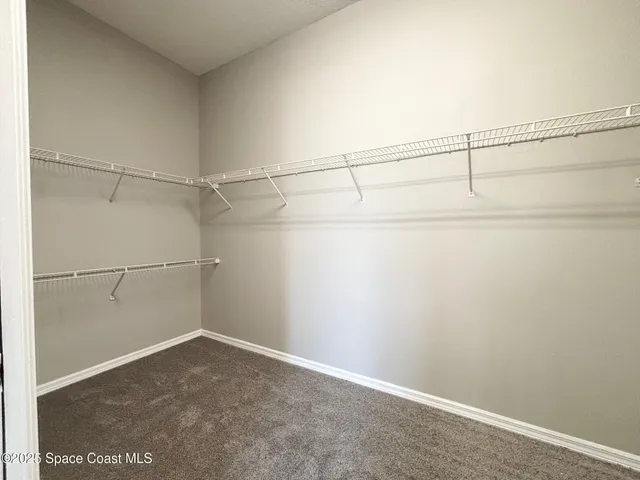 a view of a room with racks on the wall