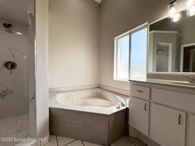 a bathroom with a bathtub and a sink