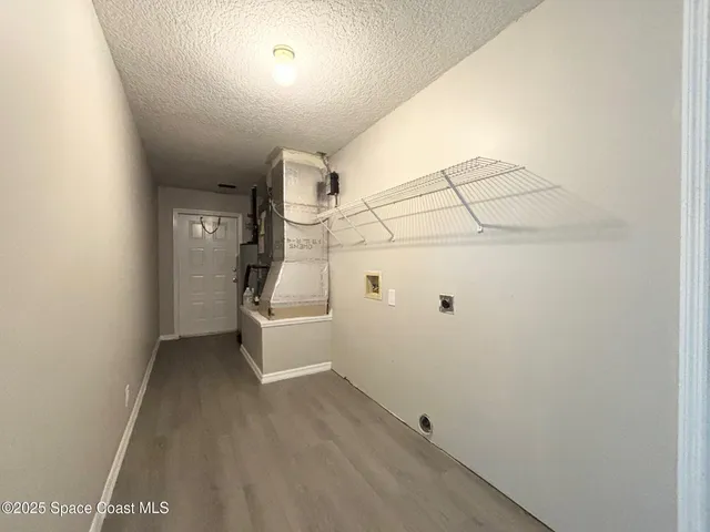 a view of a grassy field with trees