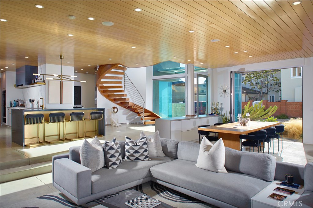 1042 West Bay Avenue Newport Beach, CA 92661 - Photo 11 of 37 a living room with furniture and wooden floor