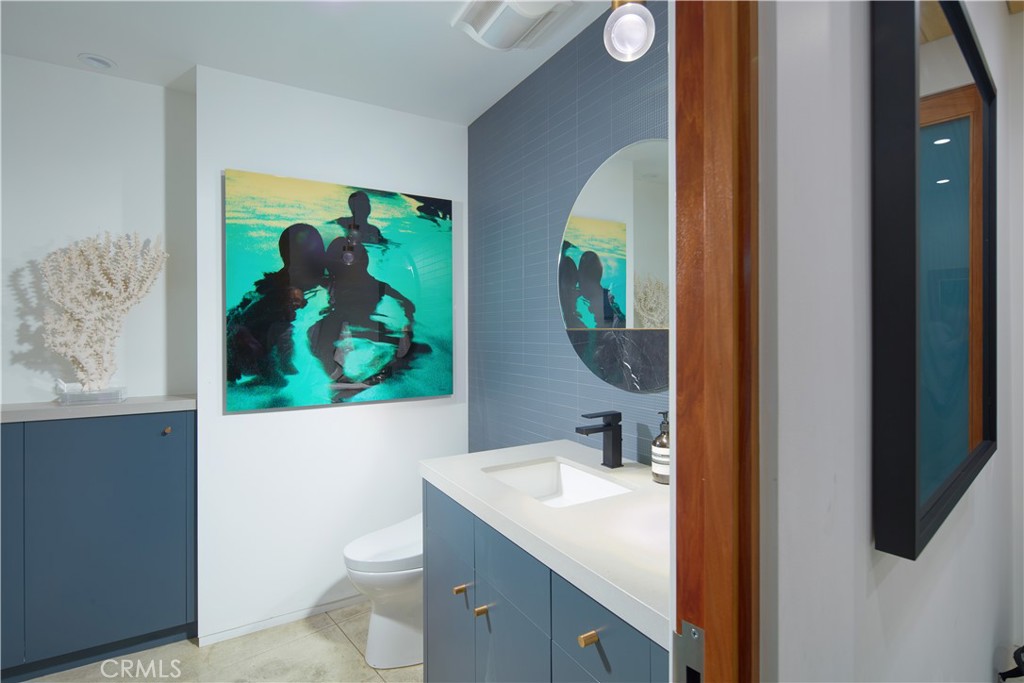 1042 West Bay Avenue Newport Beach, CA 92661 - Photo 16 of 37 a bathroom with a toilet and a sink