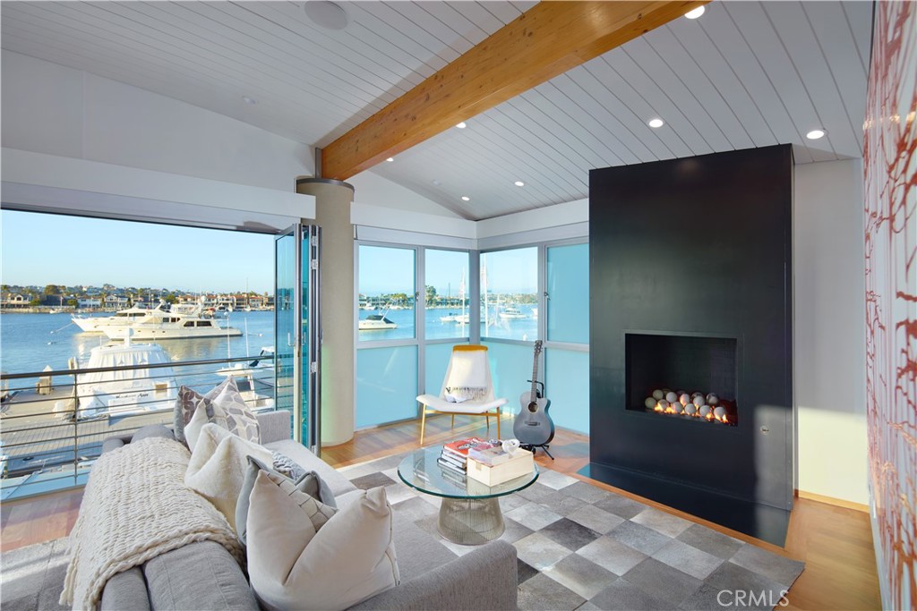 1042 West Bay Avenue Newport Beach, CA 92661 - Photo 19 of 37 a living room with furniture and a fireplace