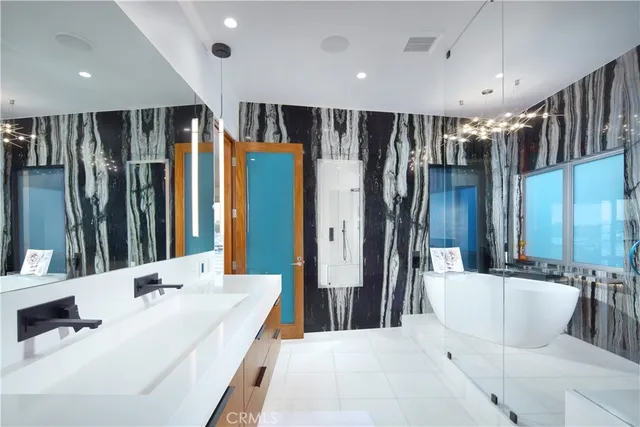 a bathroom with a bathtub and a shower