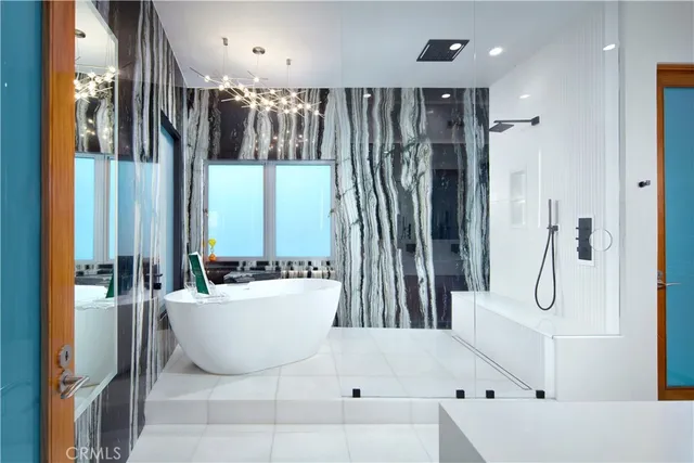 a bedroom with a bed and a television