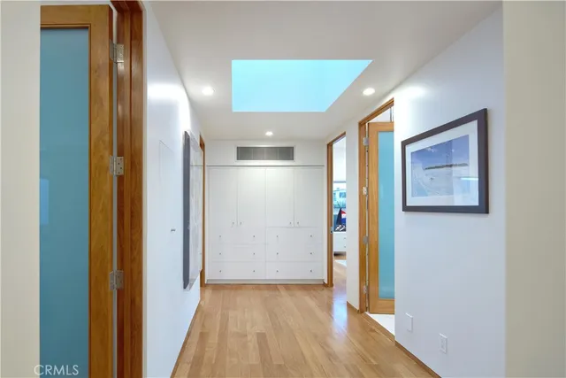 a spacious bathroom with double vanity sink a mirror a shower and bathtub