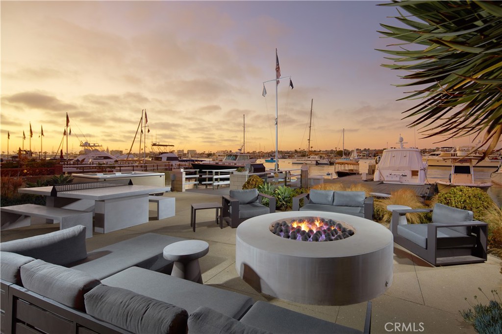 1042 West Bay Avenue Newport Beach, CA 92661 - Photo 3 of 37 a view of a patio with couches chairs and a potted plant