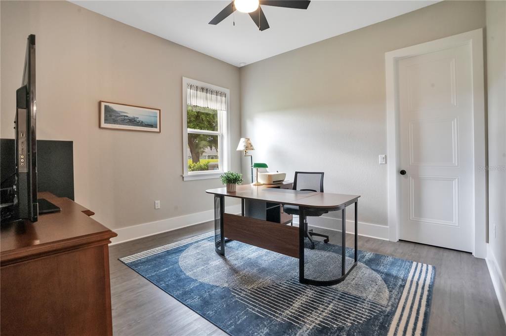 440 Palma Ceia Road Winter Haven, FL 33884 - Photo 41 of 78 a view of a workspace with furniture and a window