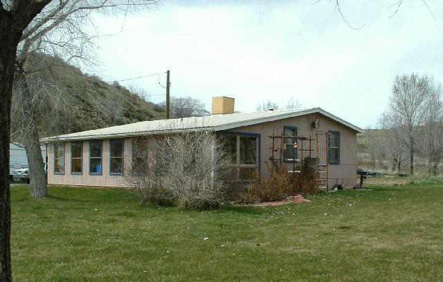 1400 West 2nd Street Rifle, CO 81650 - Photo 1 of 5 a view of a house with backyard