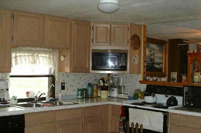1400 West 2nd Street Rifle, CO 81650 - Photo 2 of 5 a kitchen with a sink cabinets and window
