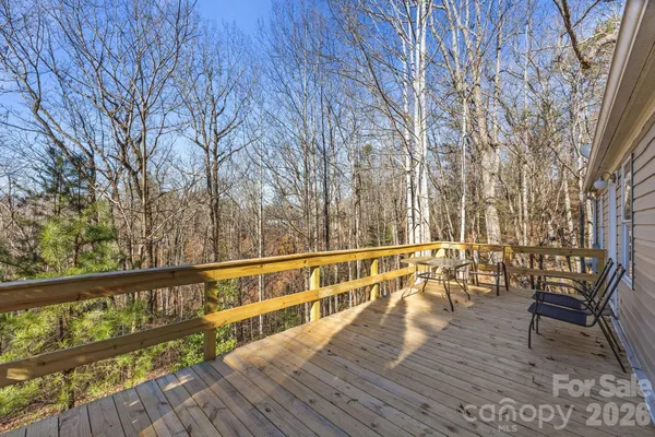 a view of balcony with wooden floor and bench