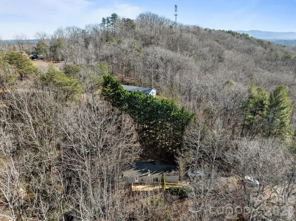 an aerial view of a house with mountain view