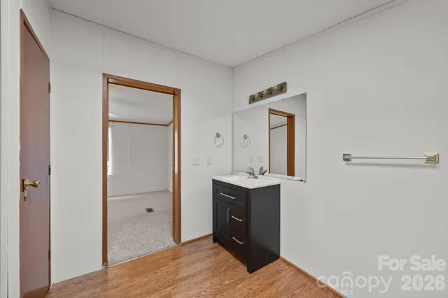 a bathroom with a glass shower door