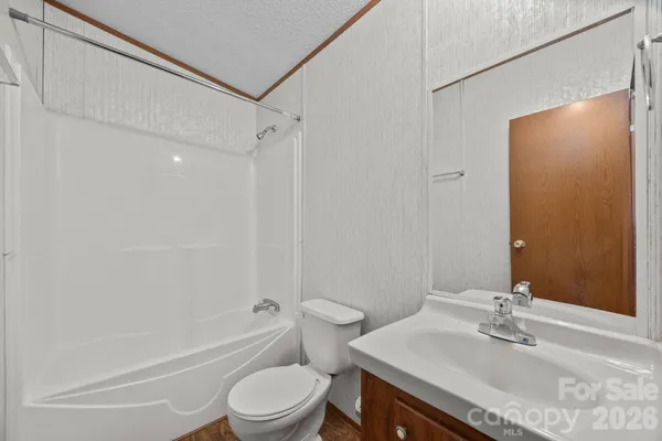 a view of hallway with wooden floor