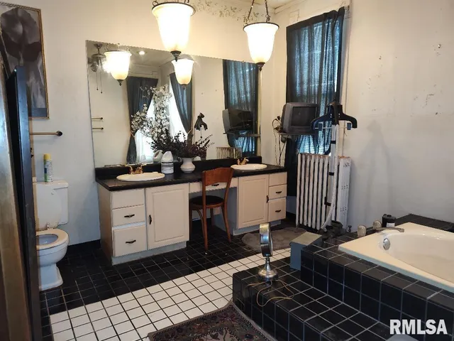 a bath room with a toilet and a shower