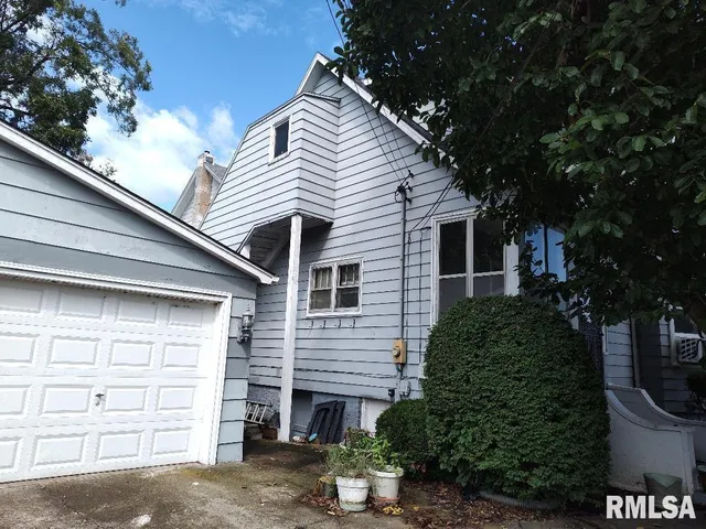 a front view of a house with a garage