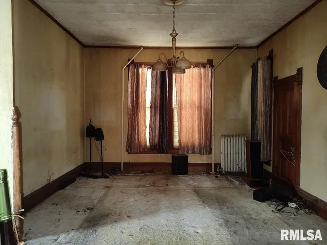 a view of room with a window and a door