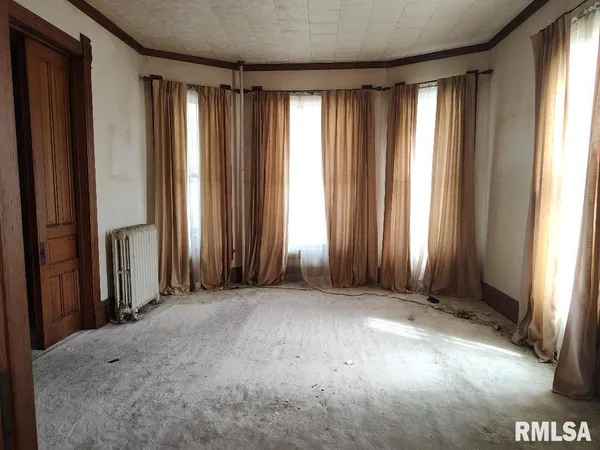an empty room with windows