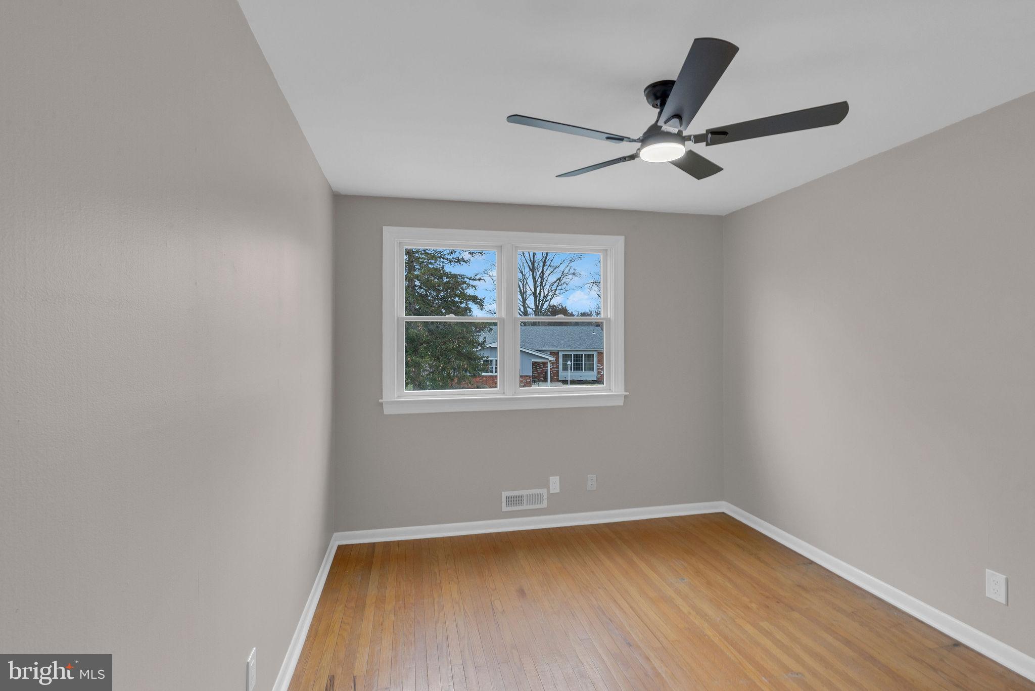 122 Leeds Road Mount Laurel, NJ 08054 - Photo 25 of 36 a view of empty room with wooden floor and fan