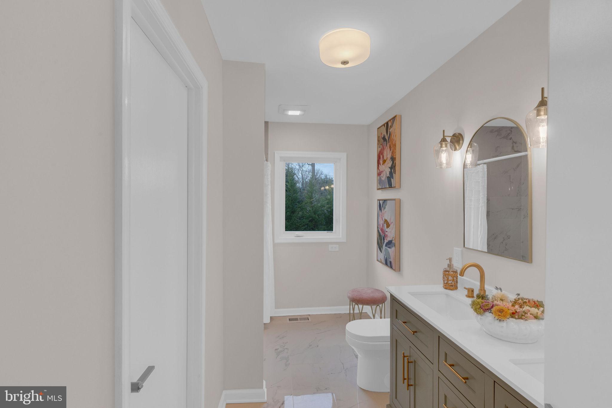 122 Leeds Road Mount Laurel, NJ 08054 - Photo 28 of 36 a bathroom with a granite countertop sink a toilet and a mirror
