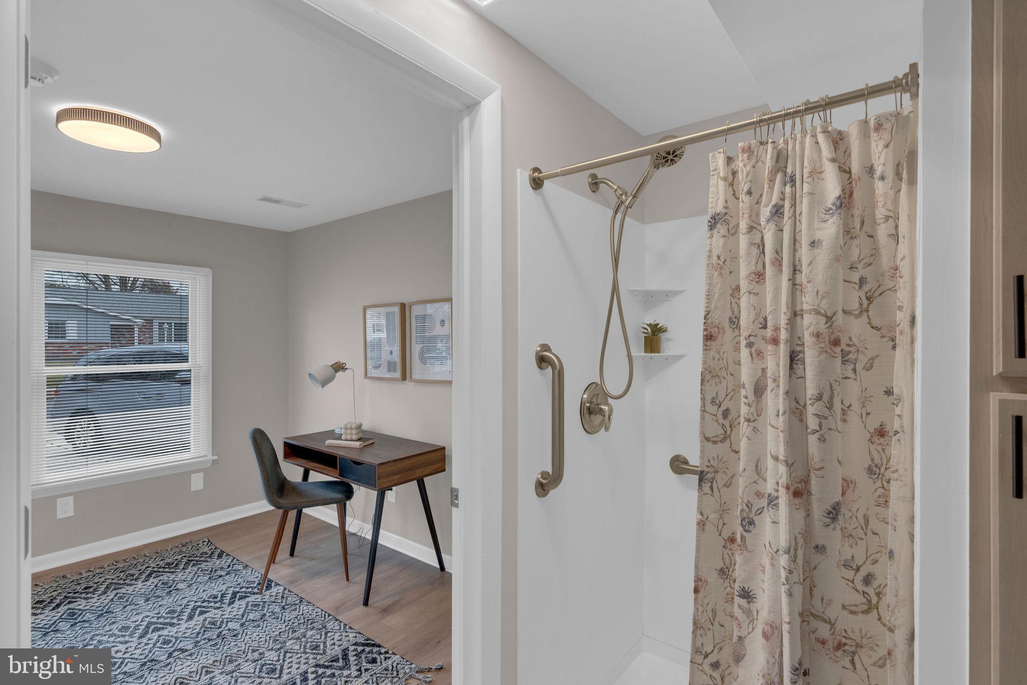 122 Leeds Road Mount Laurel, NJ 08054 - Photo 6 of 36 a bathroom with a shower curtain and a window