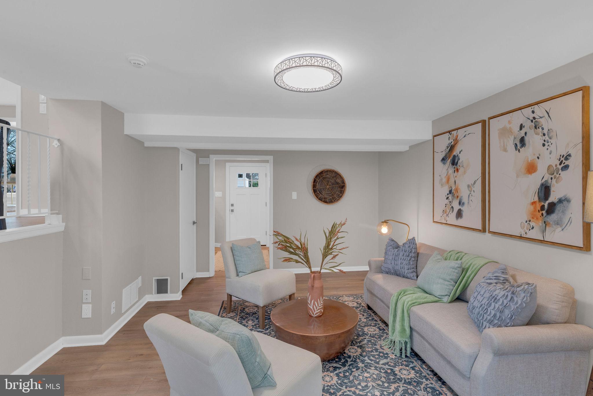 122 Leeds Road Mount Laurel, NJ 08054 - Photo 9 of 36 a living room with furniture and a large window