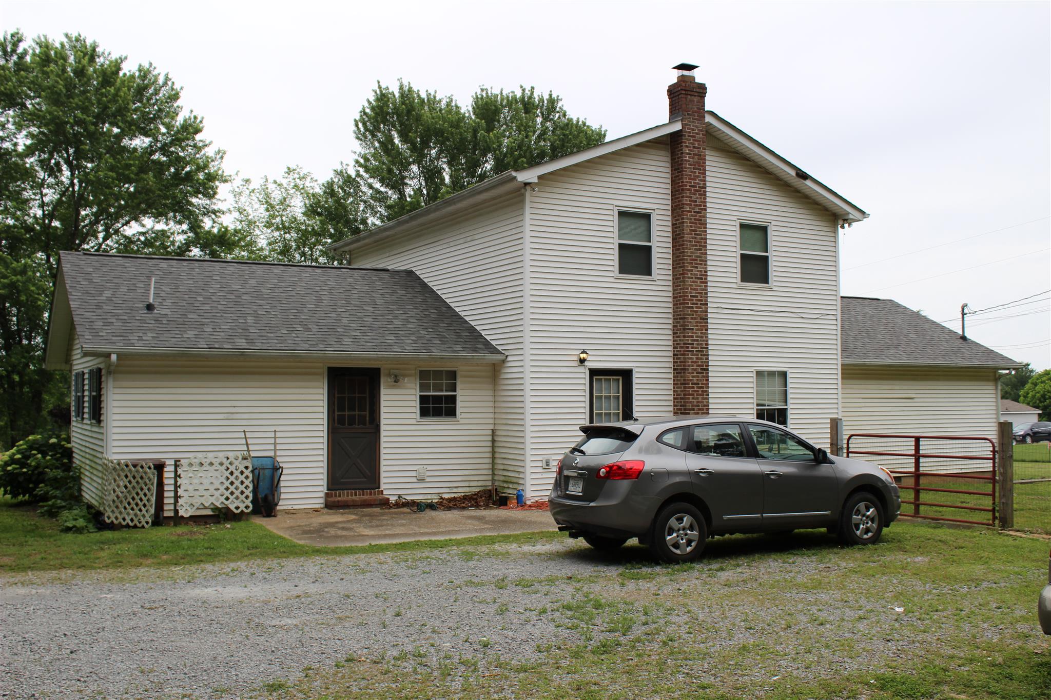 4749 Ollie Chunn Road Spring Hill, TN 37174 - Photo 3 of 11 a car parked in front of white house