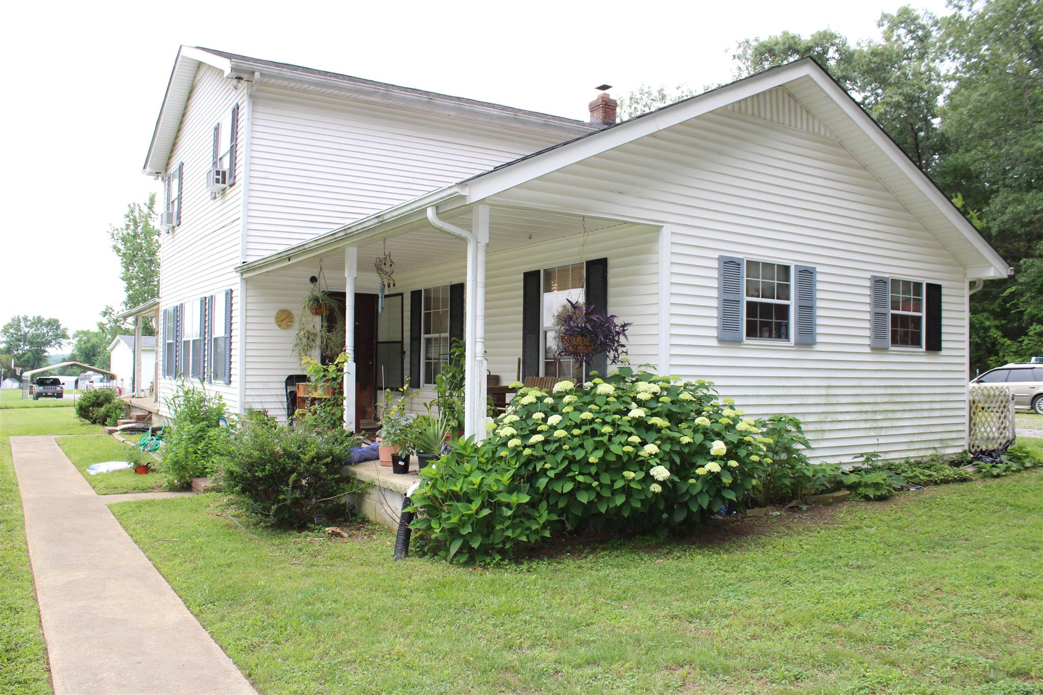 4749 Ollie Chunn Road Spring Hill, TN 37174 - Photo 4 of 11 a front view of a house with garden