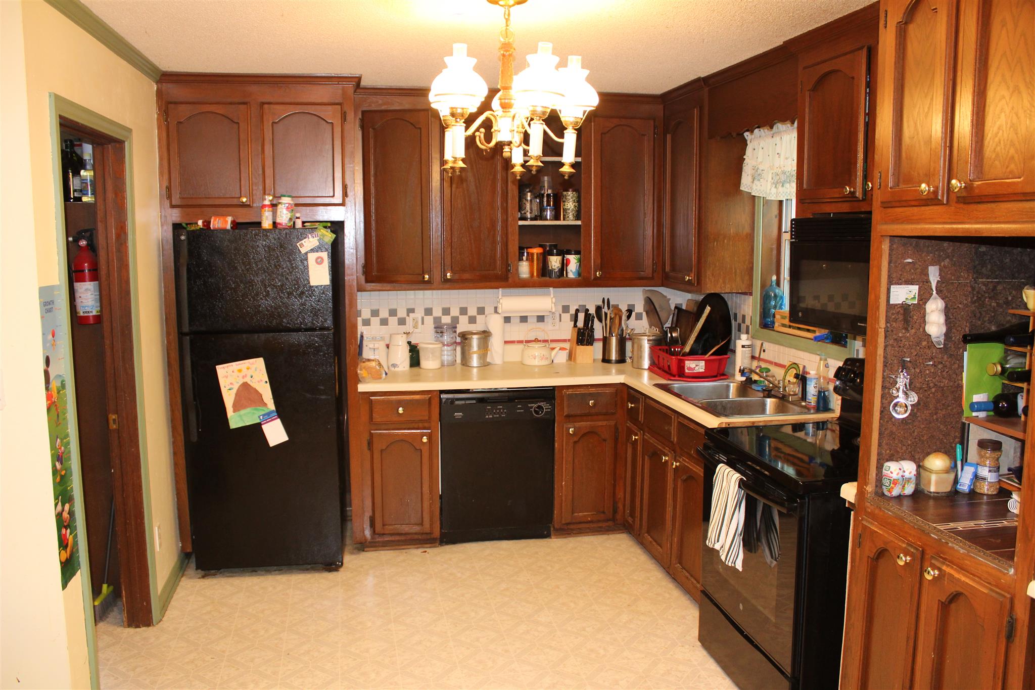 4749 Ollie Chunn Road Spring Hill, TN 37174 - Photo 9 of 11 a kitchen with a sink cabinets and appliances