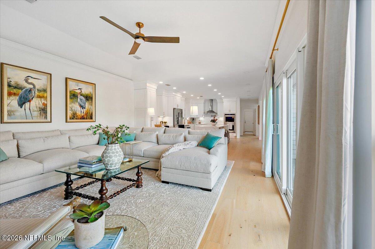 2253 Beachcomber Trail Atlantic Beach, FL 32233 - Photo 13 of 42 a living room with furniture and a chandelier