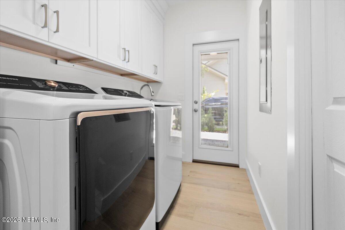 2253 Beachcomber Trail Atlantic Beach, FL 32233 - Photo 18 of 42 a utility room with wooden floor washer and dryer