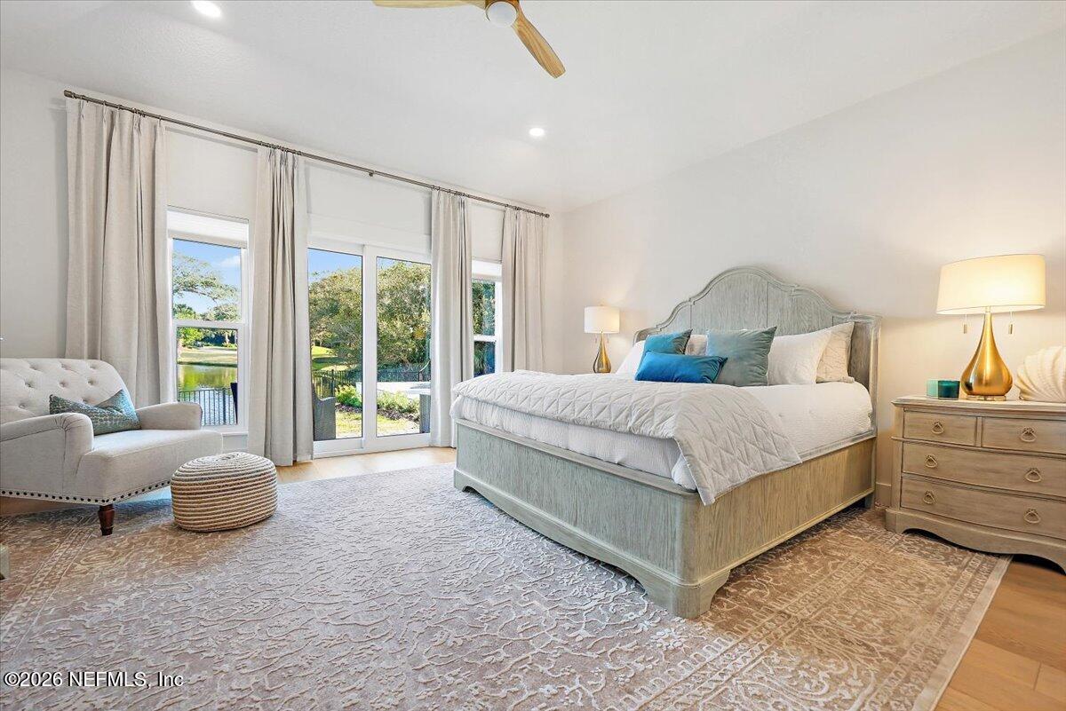 2253 Beachcomber Trail Atlantic Beach, FL 32233 - Photo 20 of 42 a bedroom with a bed and large window