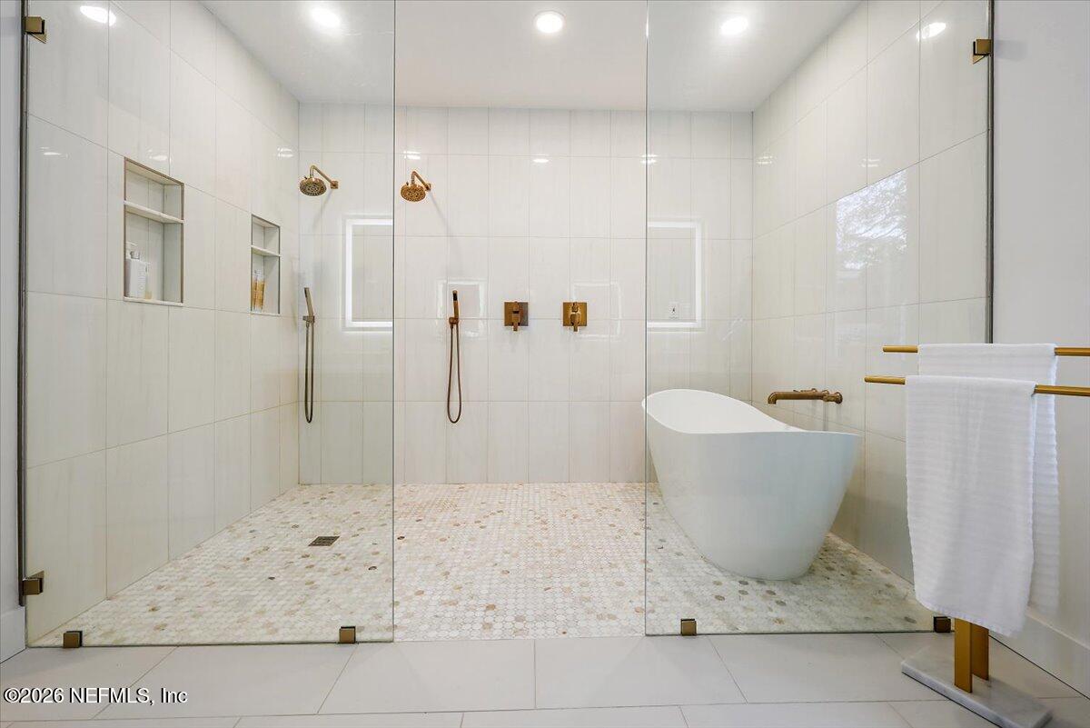 2253 Beachcomber Trail Atlantic Beach, FL 32233 - Photo 22 of 42 a bathroom with a bathtub and shower