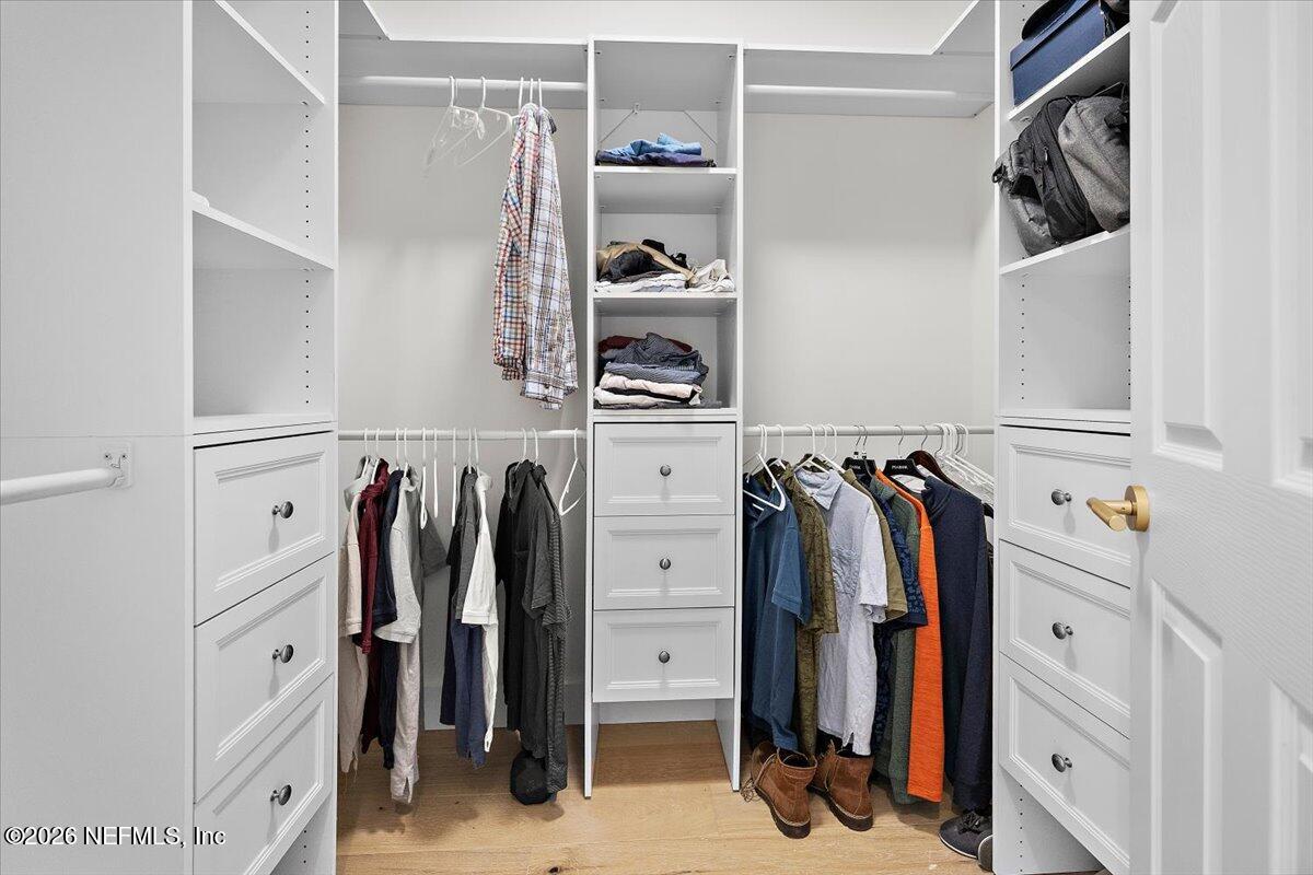 2253 Beachcomber Trail Atlantic Beach, FL 32233 - Photo 24 of 42 a view of walk in closet with clothes and shoes