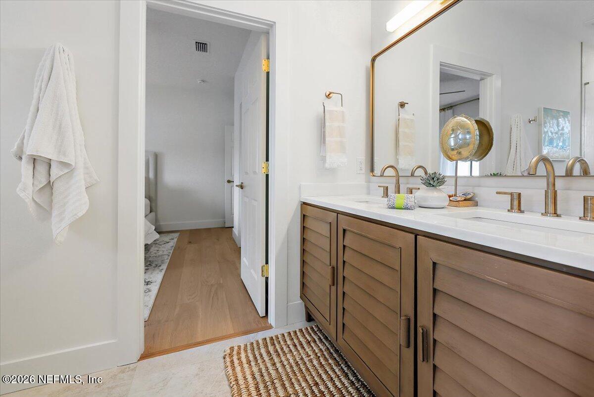 2253 Beachcomber Trail Atlantic Beach, FL 32233 - Photo 28 of 42 a bathroom with a sink and a mirror