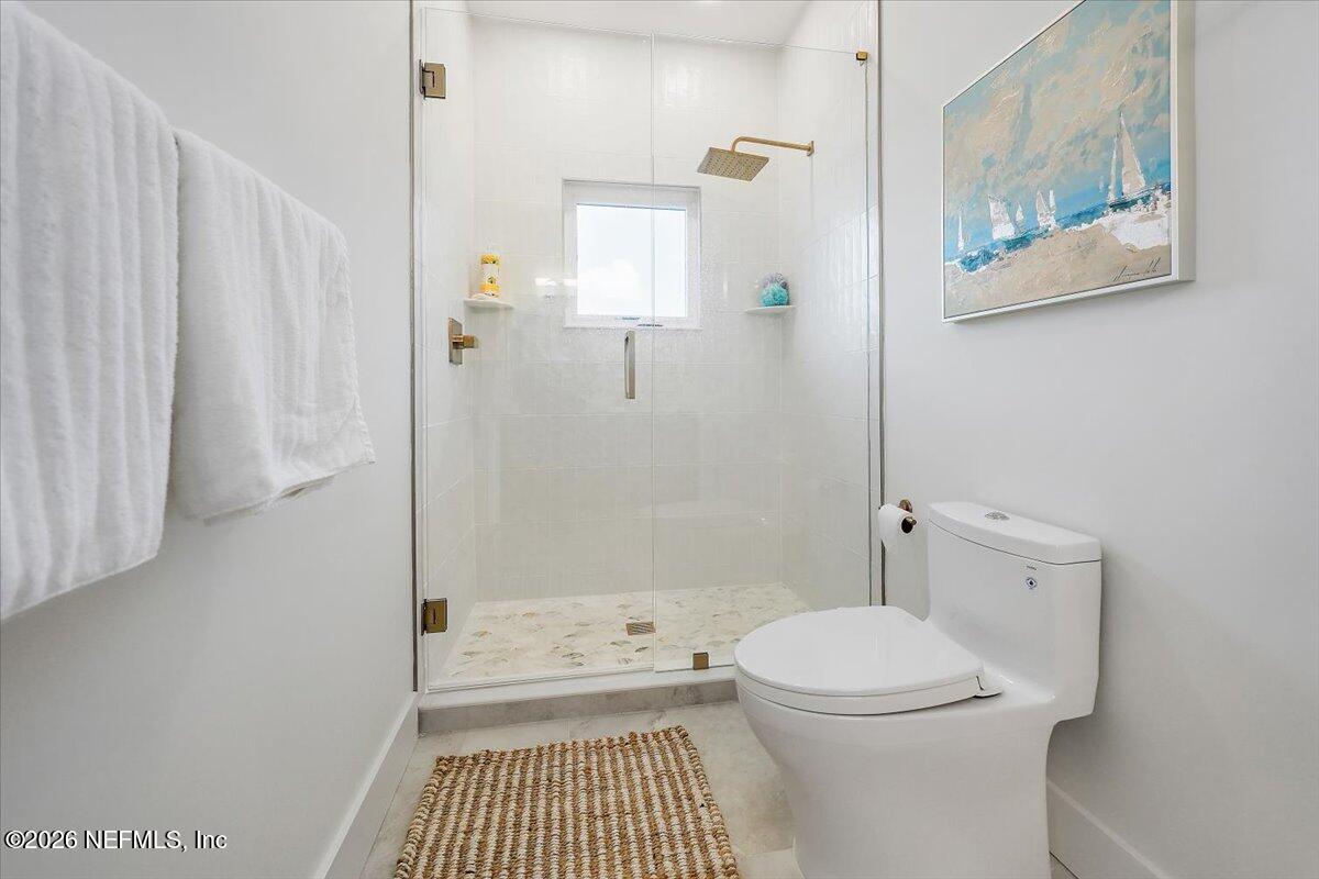 2253 Beachcomber Trail Atlantic Beach, FL 32233 - Photo 29 of 42 a bathroom with a toilet and a shower