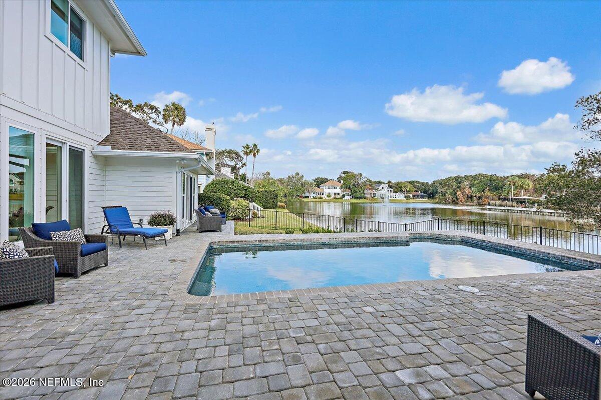 2253 Beachcomber Trail Atlantic Beach, FL 32233 - Photo 31 of 42 a swimming pool with outdoor seating and barbeque oven