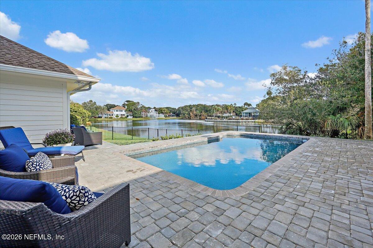2253 Beachcomber Trail Atlantic Beach, FL 32233 - Photo 32 of 42 a view of a swimming pool and lounge chair