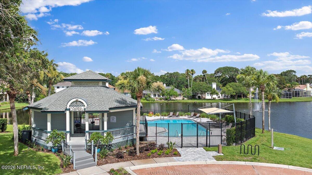 2253 Beachcomber Trail Atlantic Beach, FL 32233 - Photo 40 of 42 a front view of a house with a lake view