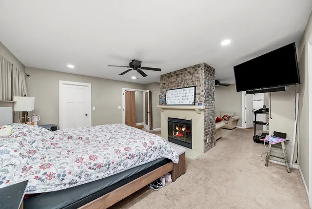 a bed room with a bed and a television