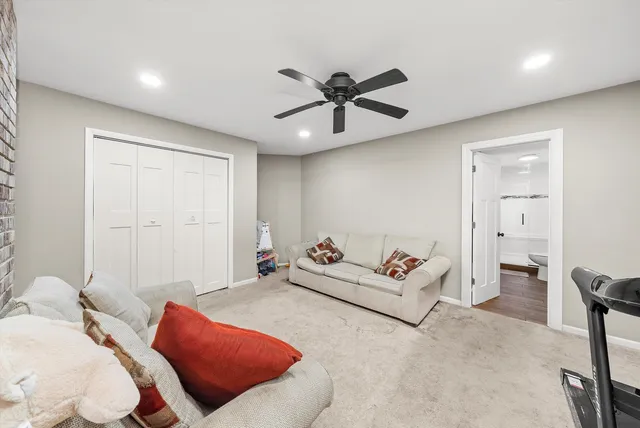 a bedroom with furniture and a chandelier