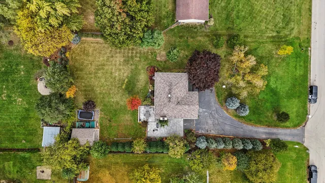 an aerial view of a house with a garden