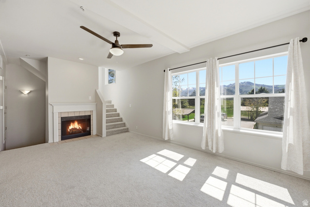 900 Bitner Road, Unit P20 Park City, UT 84098 - Photo 8 of 42 Carpeted living area featuring a fireplace with tile surround, white mantel, and hearth